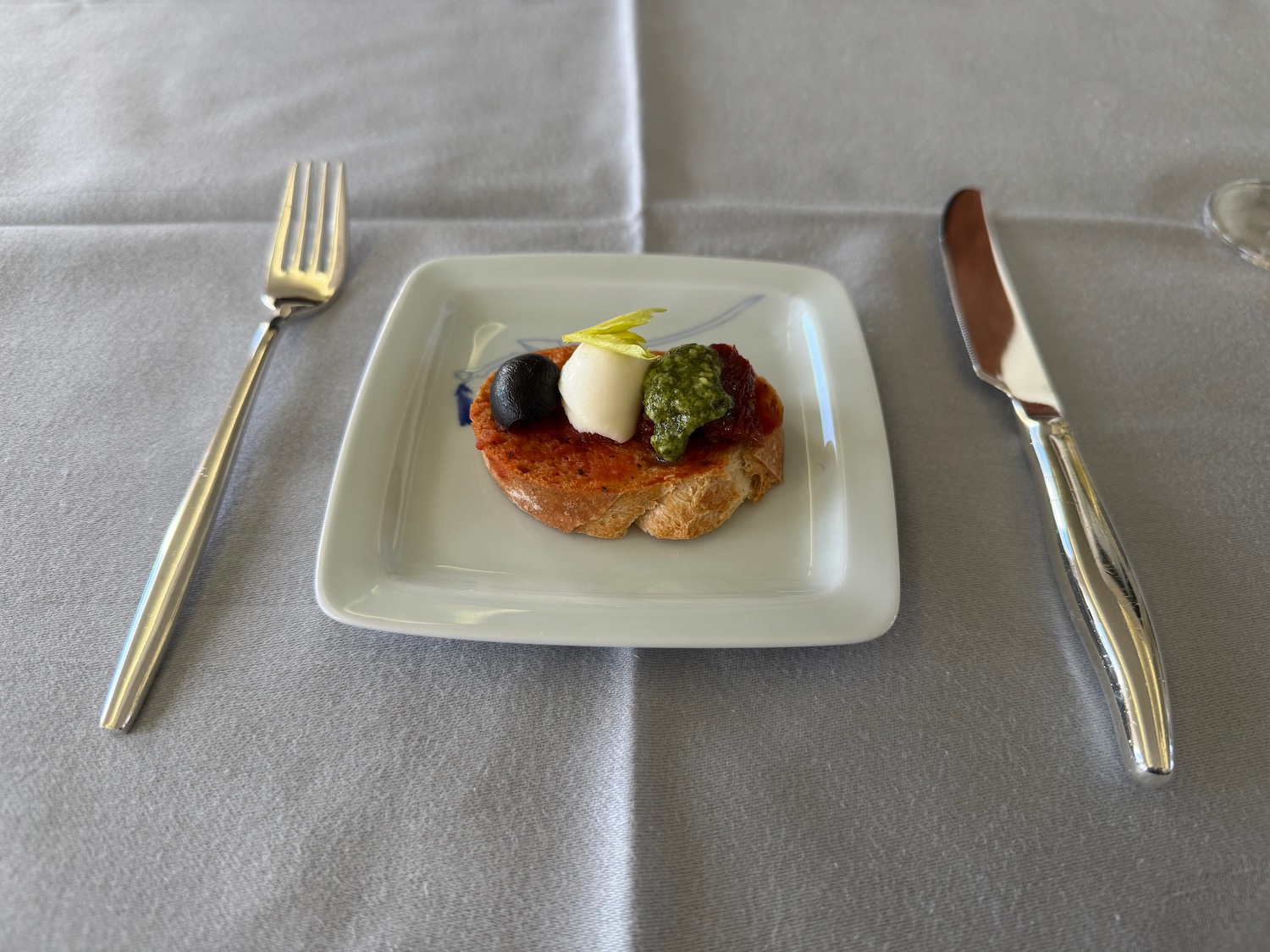 a plate with food on it and a fork and knife