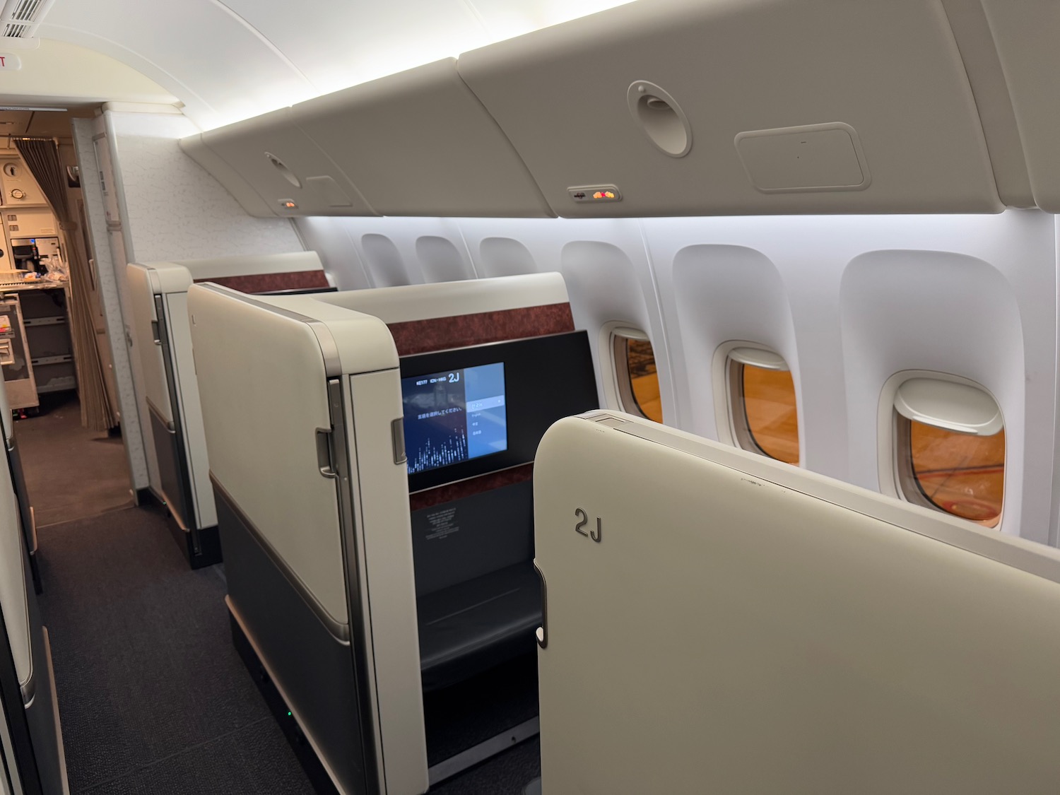 an airplane with seats and a television