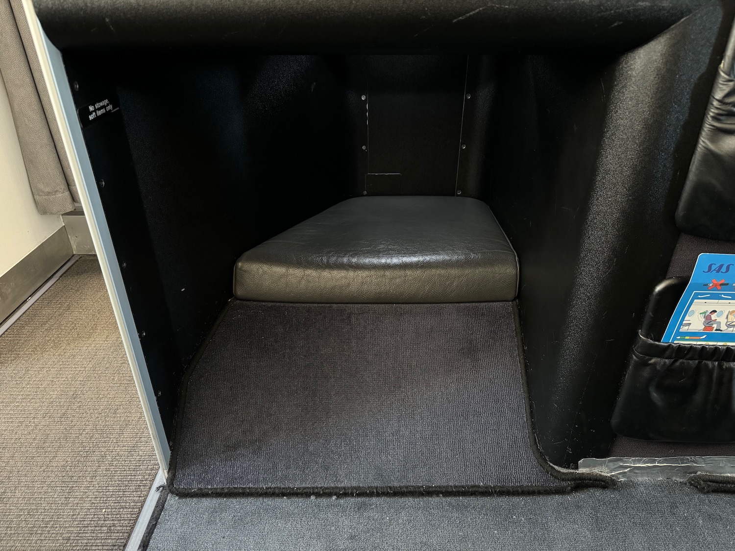 a black and grey carpeted box