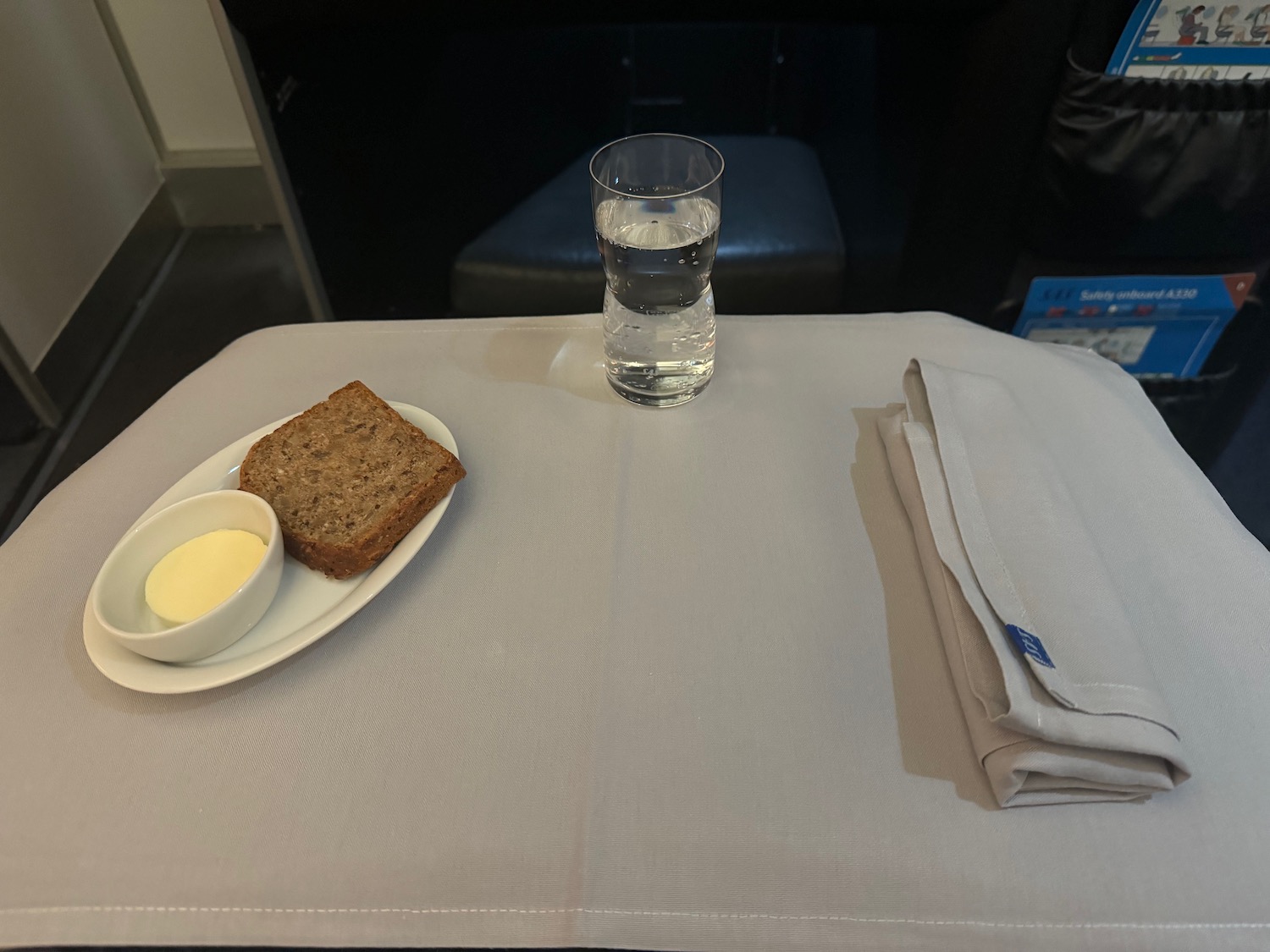 a plate of bread and butter on a table