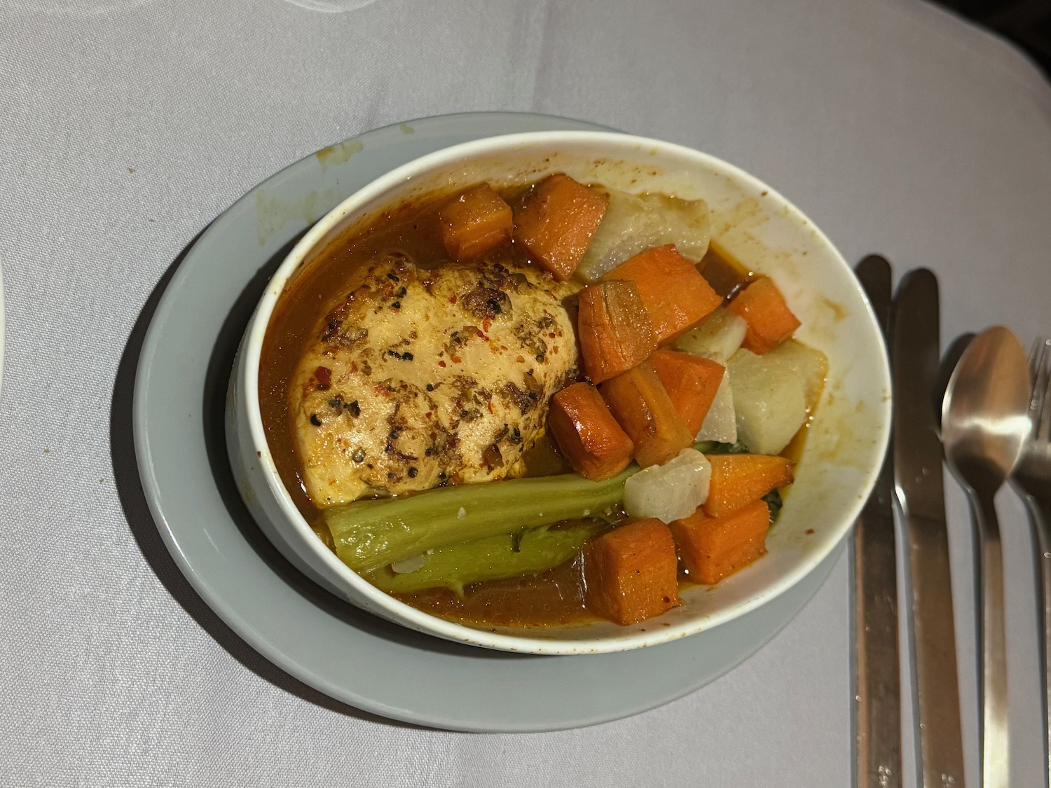 a bowl of soup with vegetables and meat