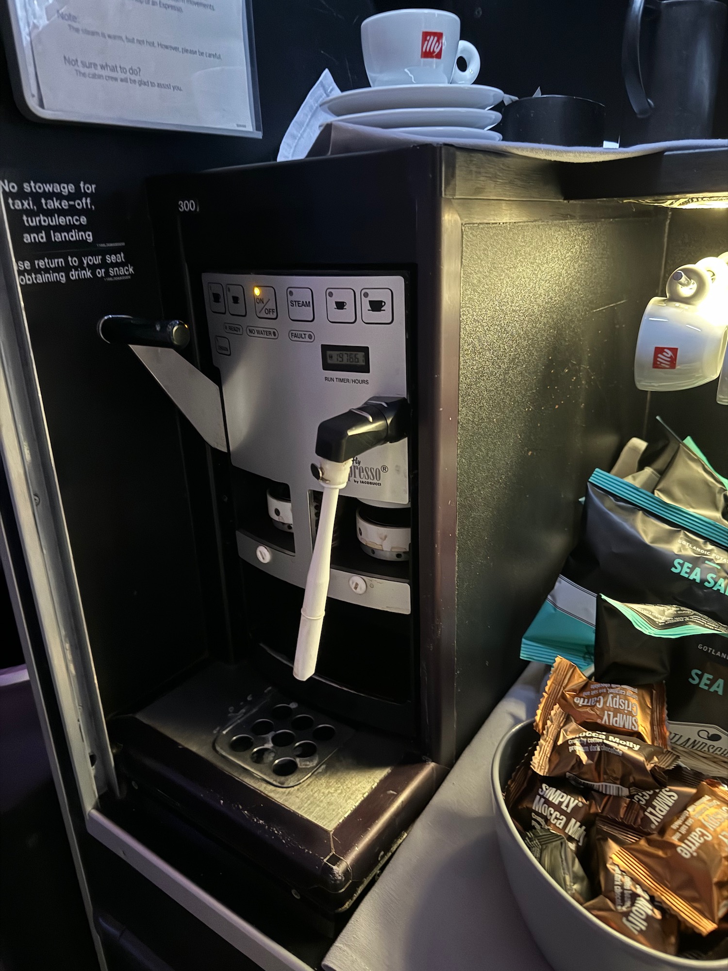 a coffee machine with a bowl of chocolates