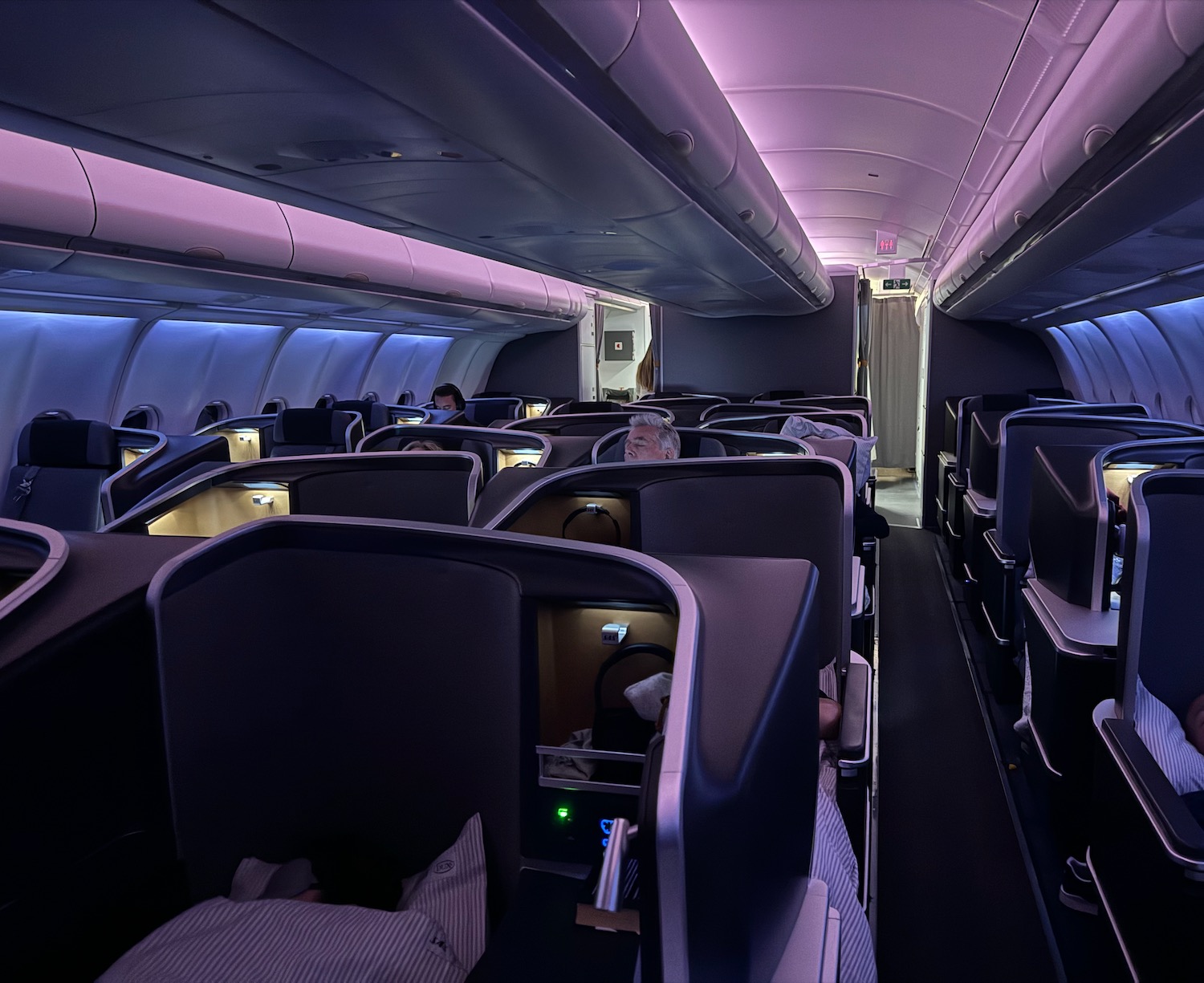 an airplane with seats and a light on the ceiling