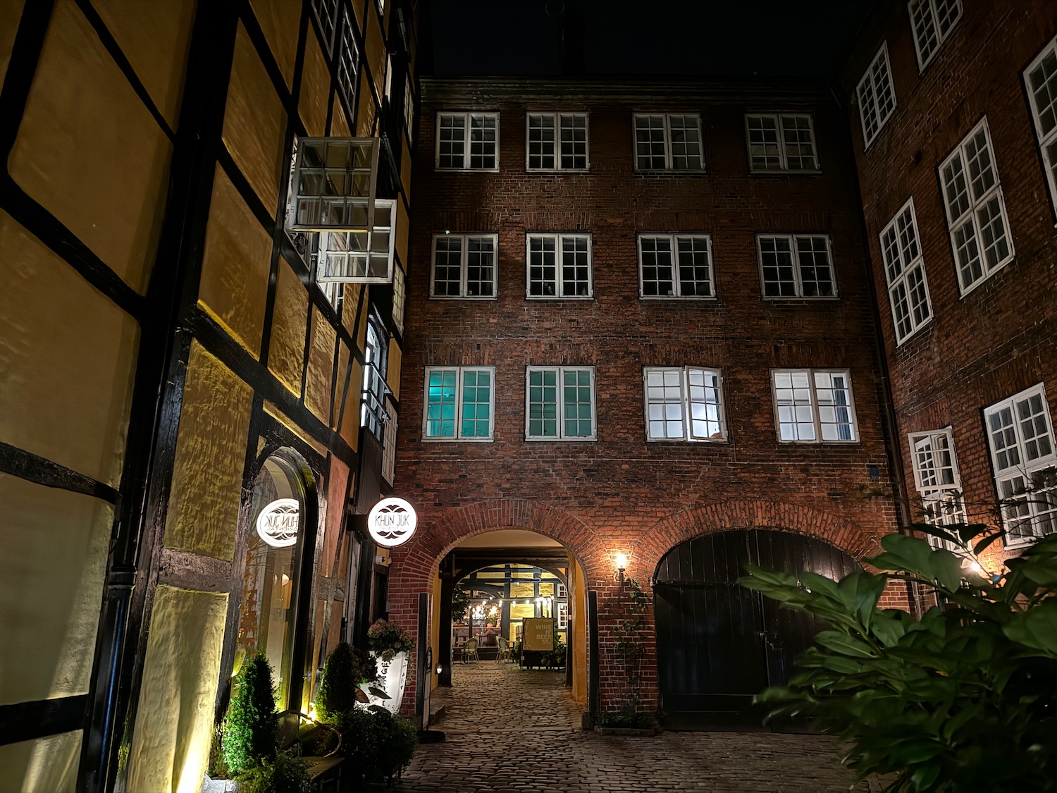 a brick building with lights at night