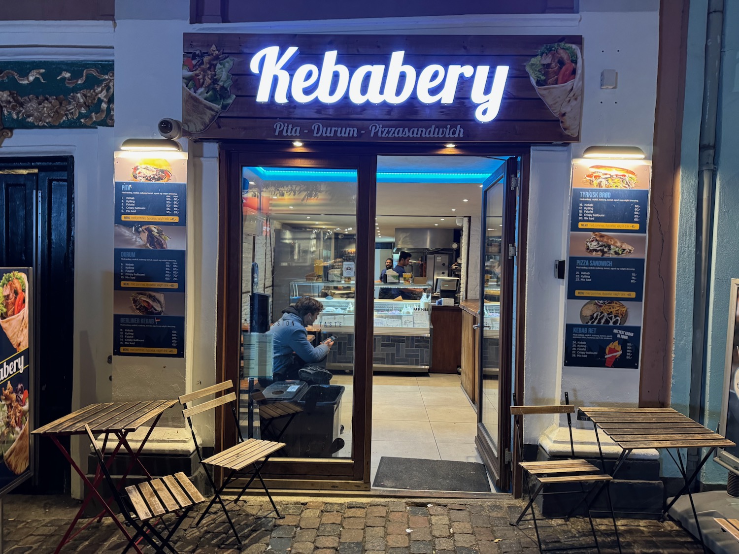 a restaurant with a sign on the front