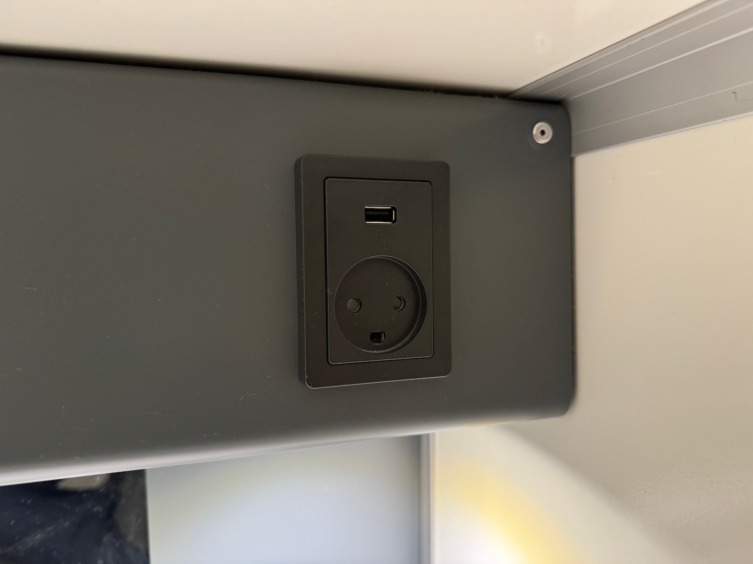 a black electrical outlet on a wall