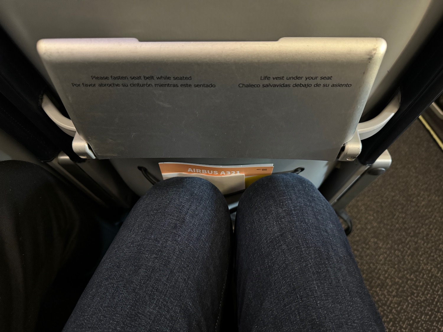 a person's legs and a seat