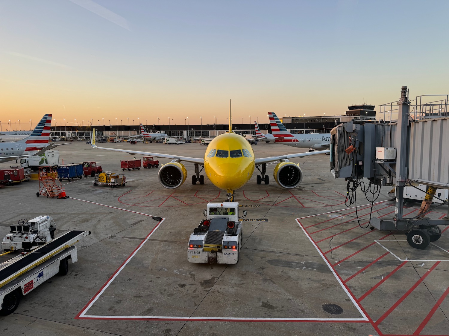 a yellow airplane on a tarmac