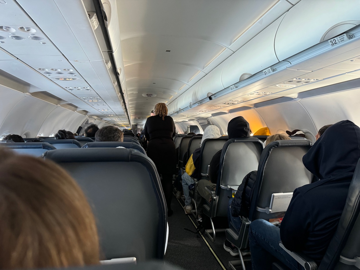 a group of people sitting in an airplane