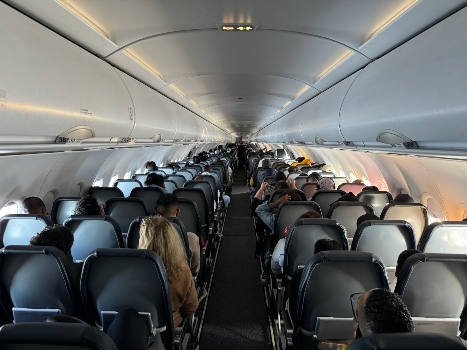 a group of people sitting in an airplane