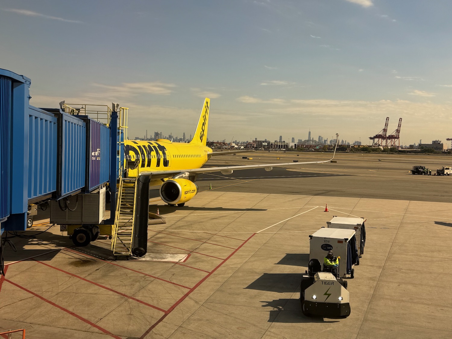 a yellow airplane on a runway