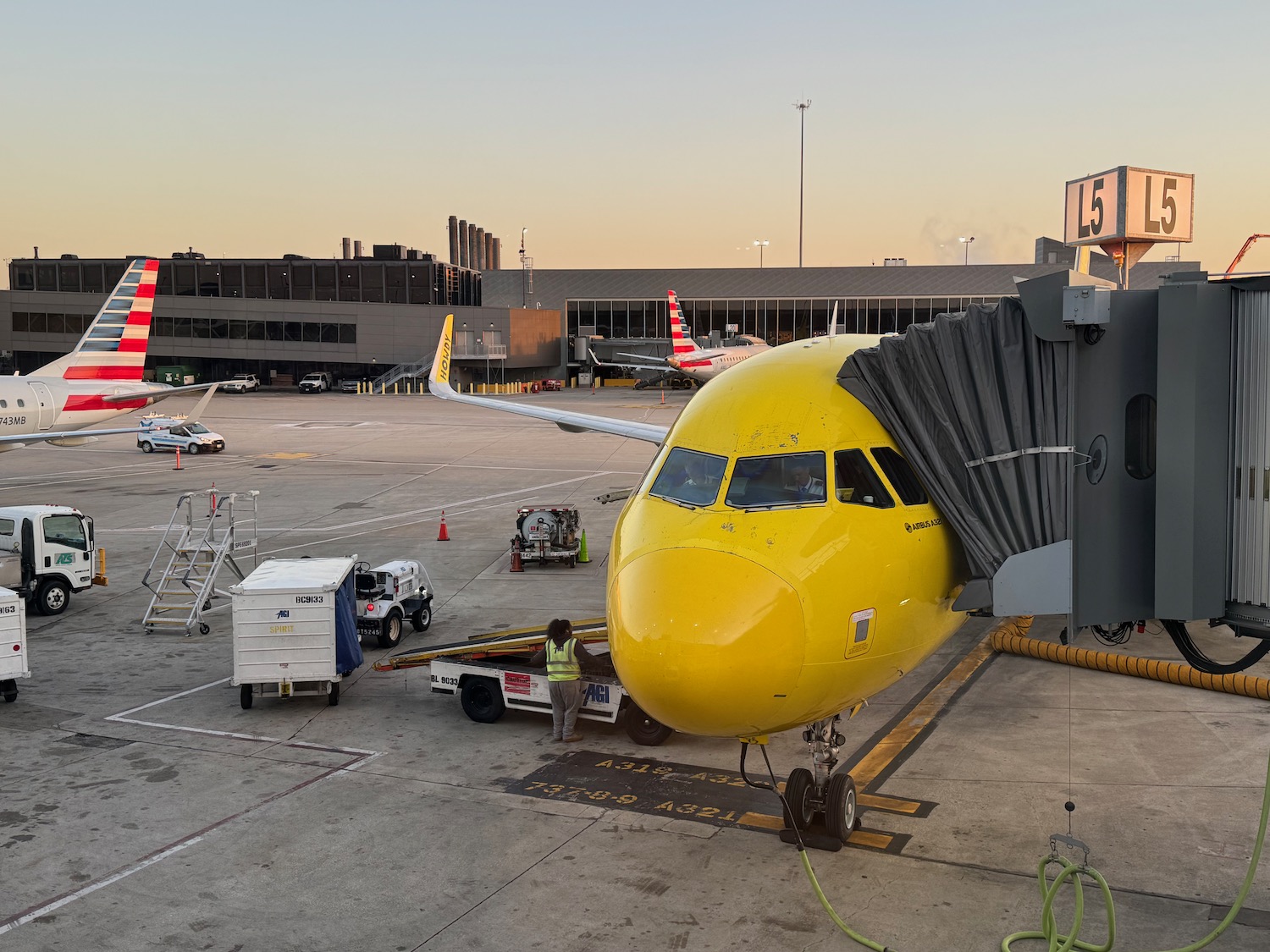 a yellow airplane at an airport