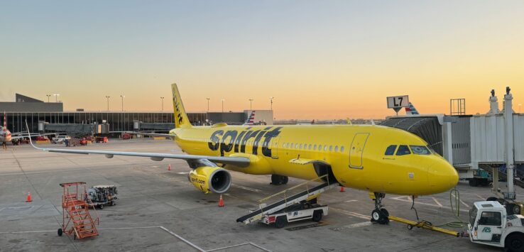 a yellow airplane on a tarmac
