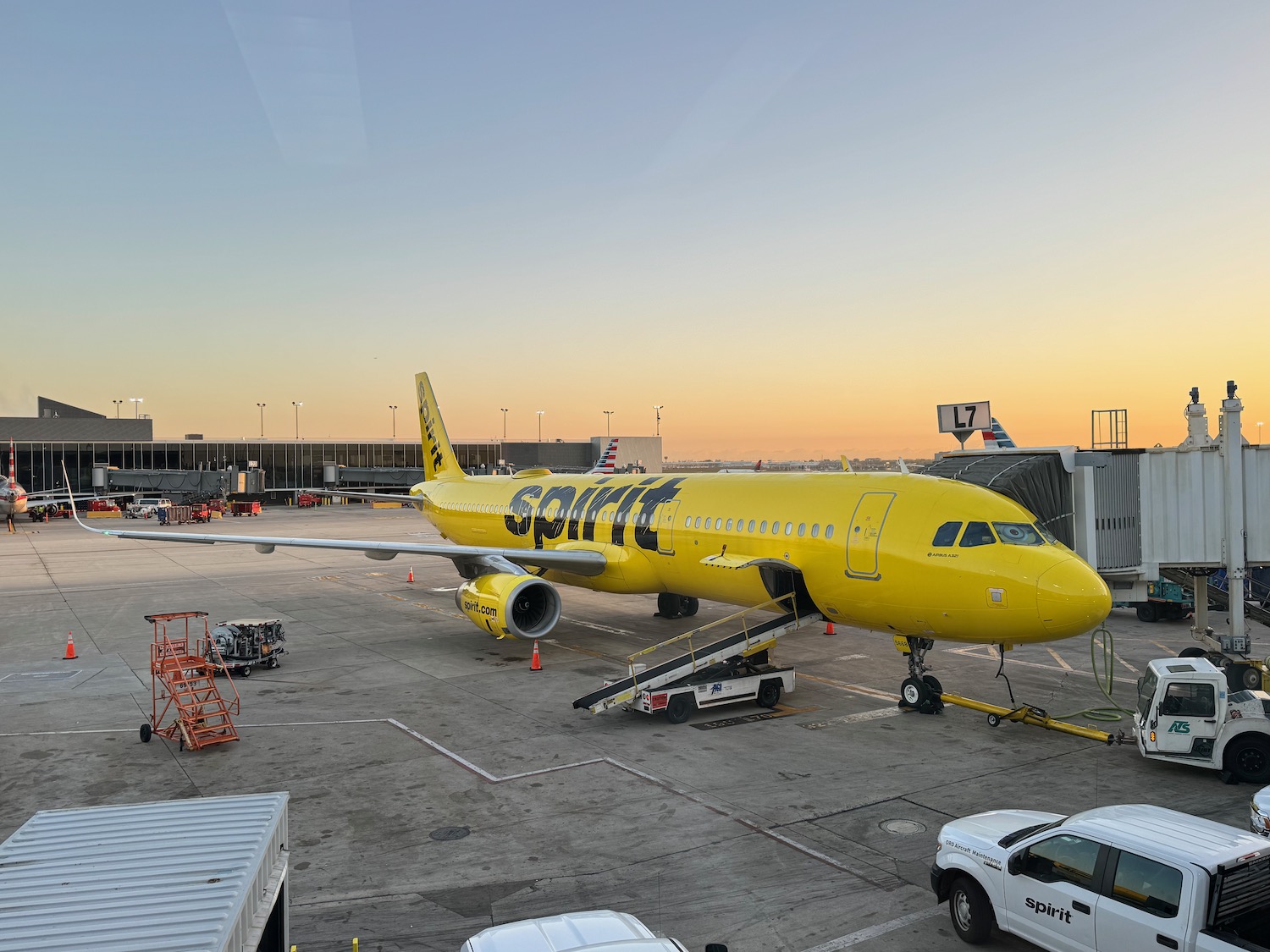 a yellow airplane on a tarmac