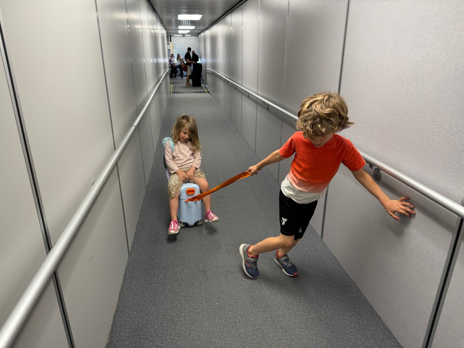 a boy and girl in a hallway