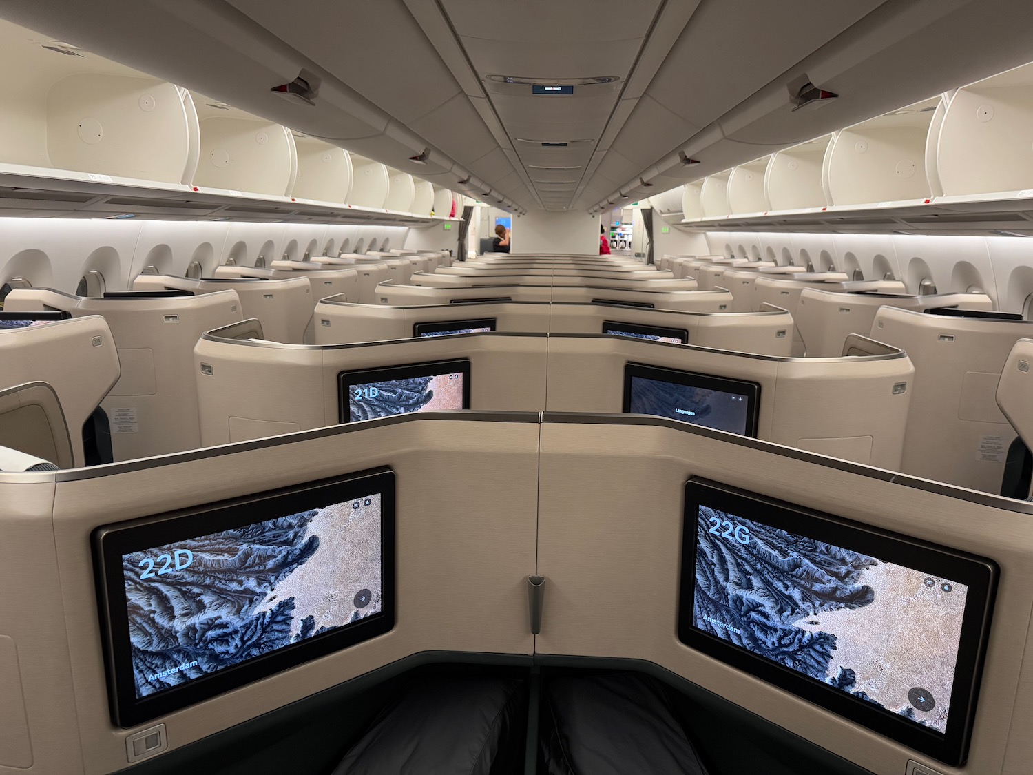 a row of monitors in an airplane