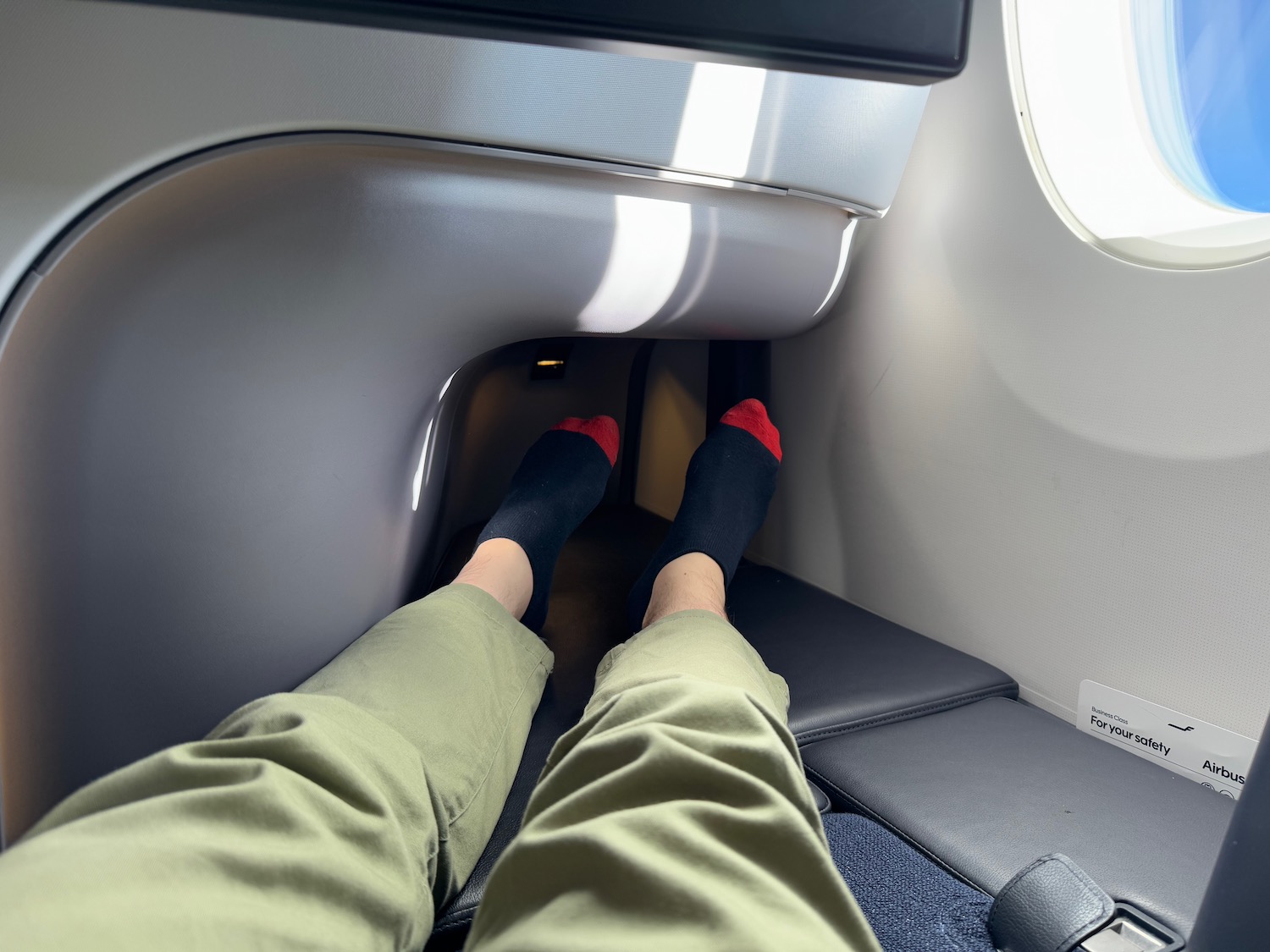 a person's legs in a seat with socks