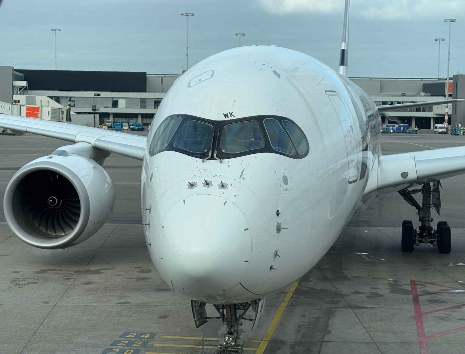 a white airplane on the tarmac