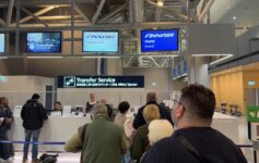 people standing in a line at a counter