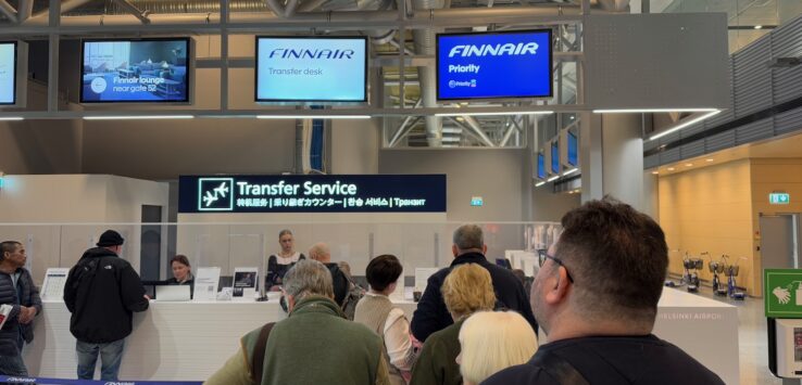 people standing in a line at a counter