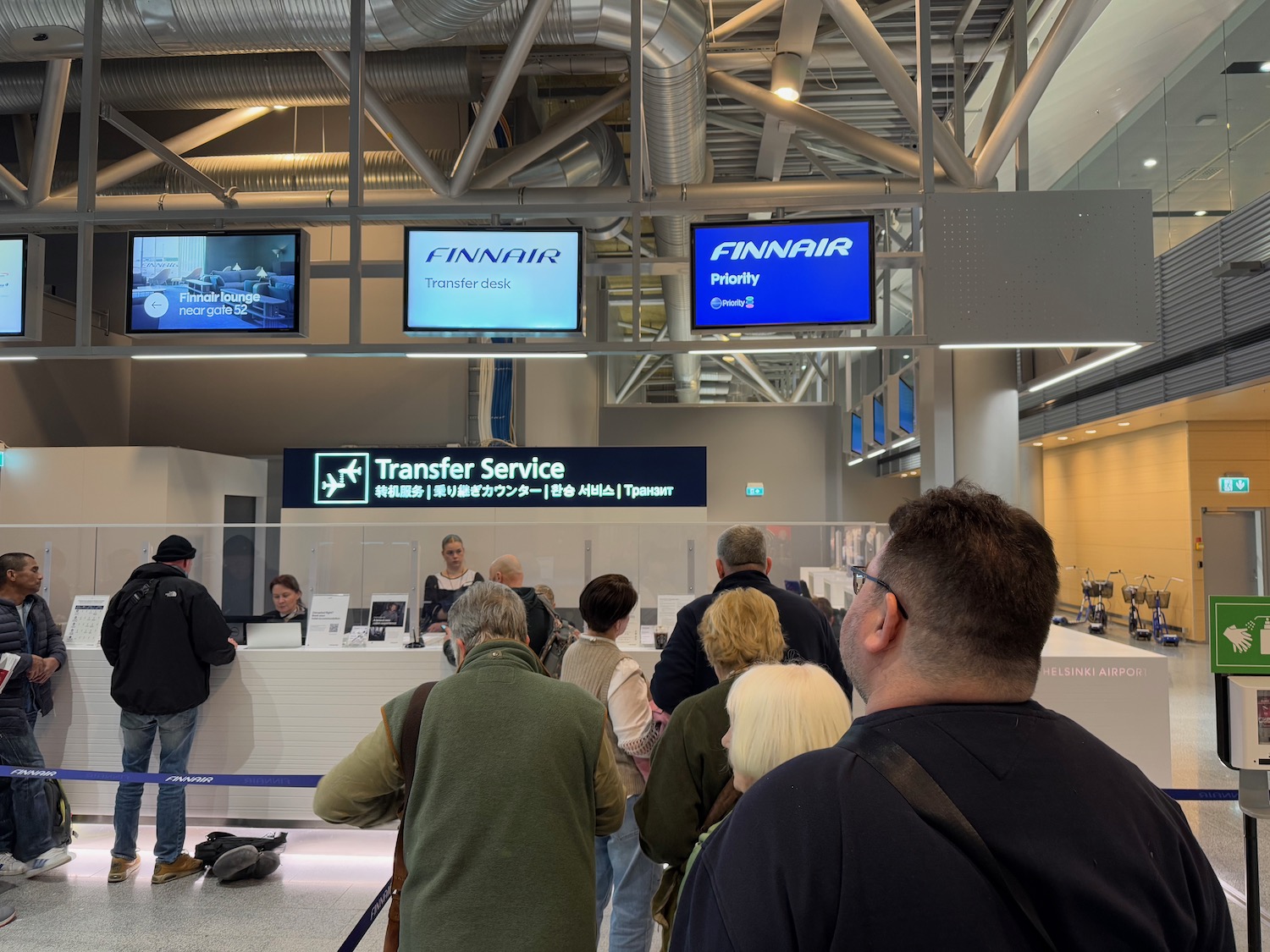 people standing in a line at a counter