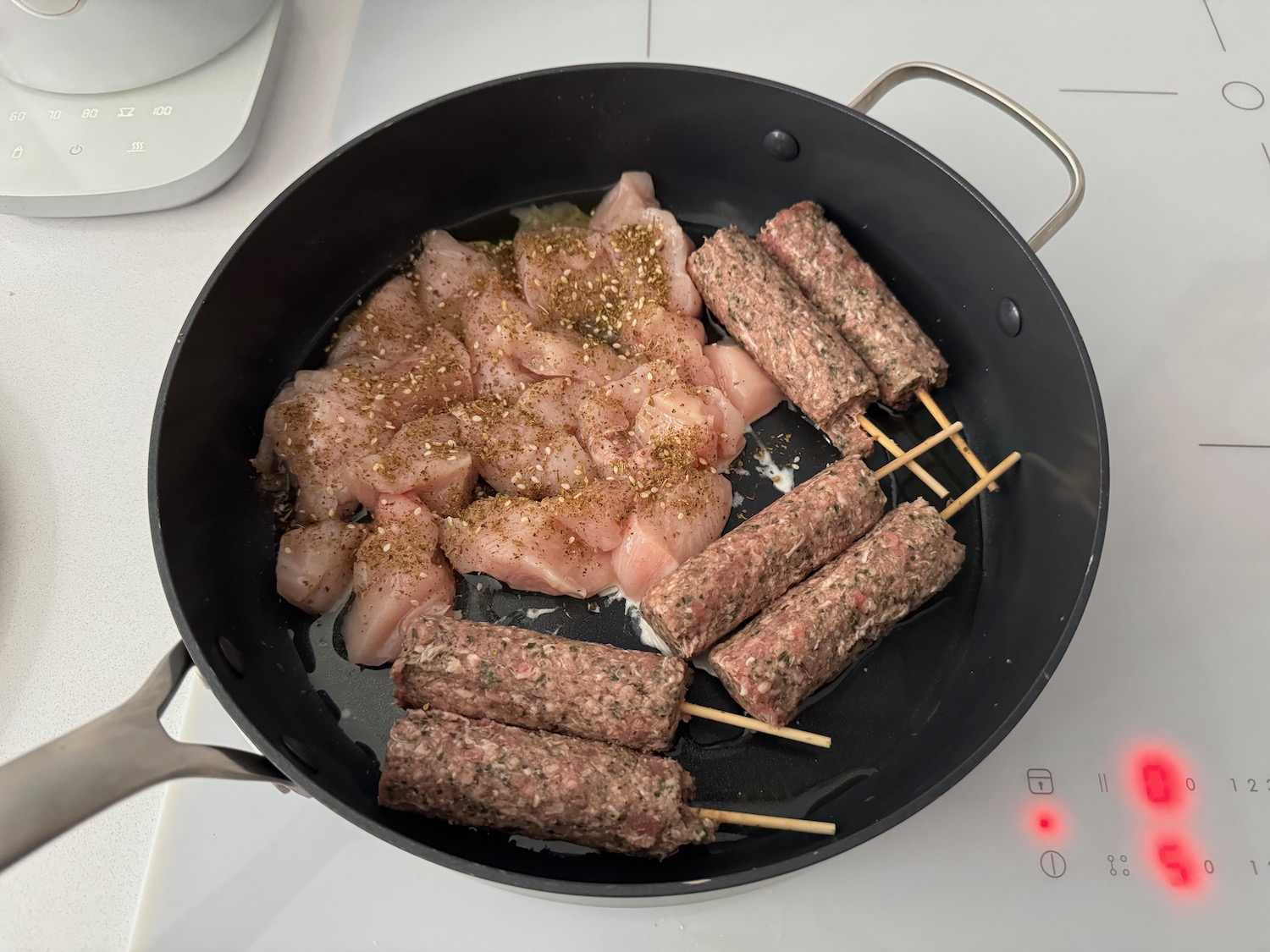 a pan with meat and spices on it