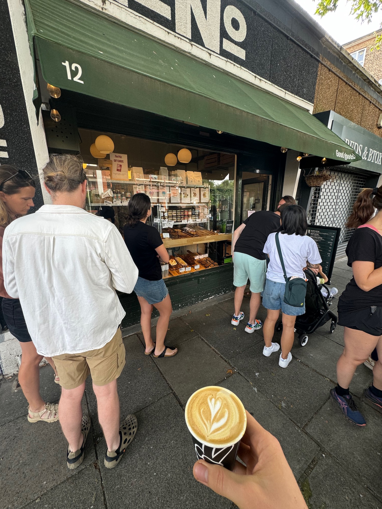 a group of people standing outside a store