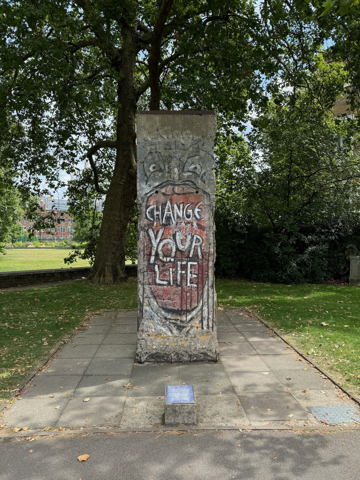 a concrete pillar with graffiti on it