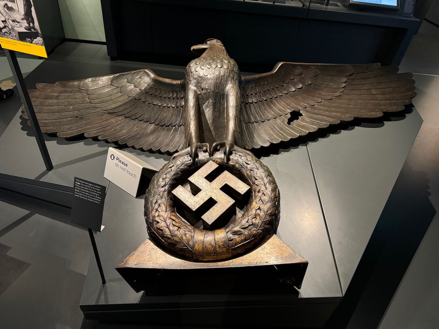 a statue of a bird with a swastika