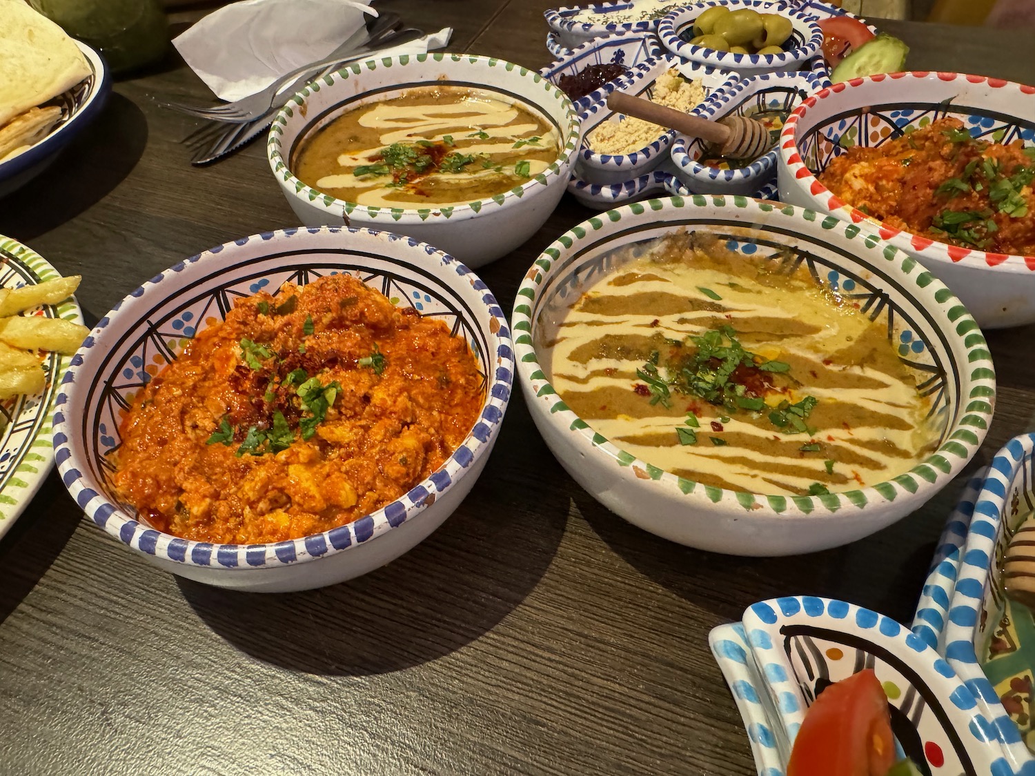 a group of bowls of food on a table