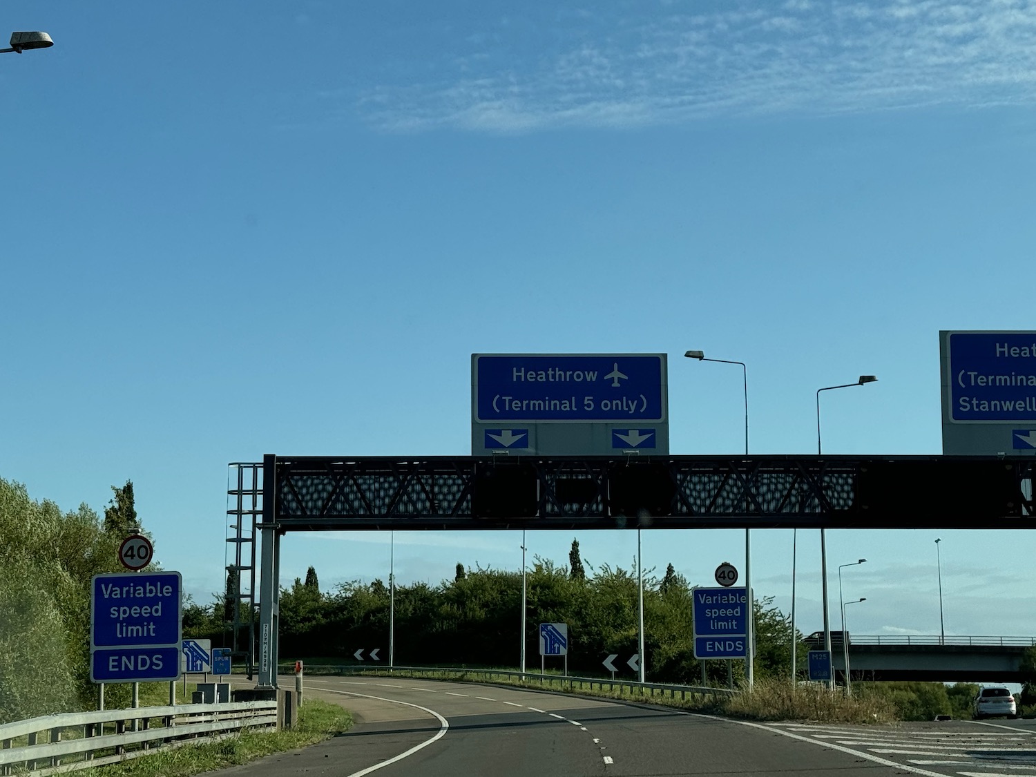 a highway with signs over it