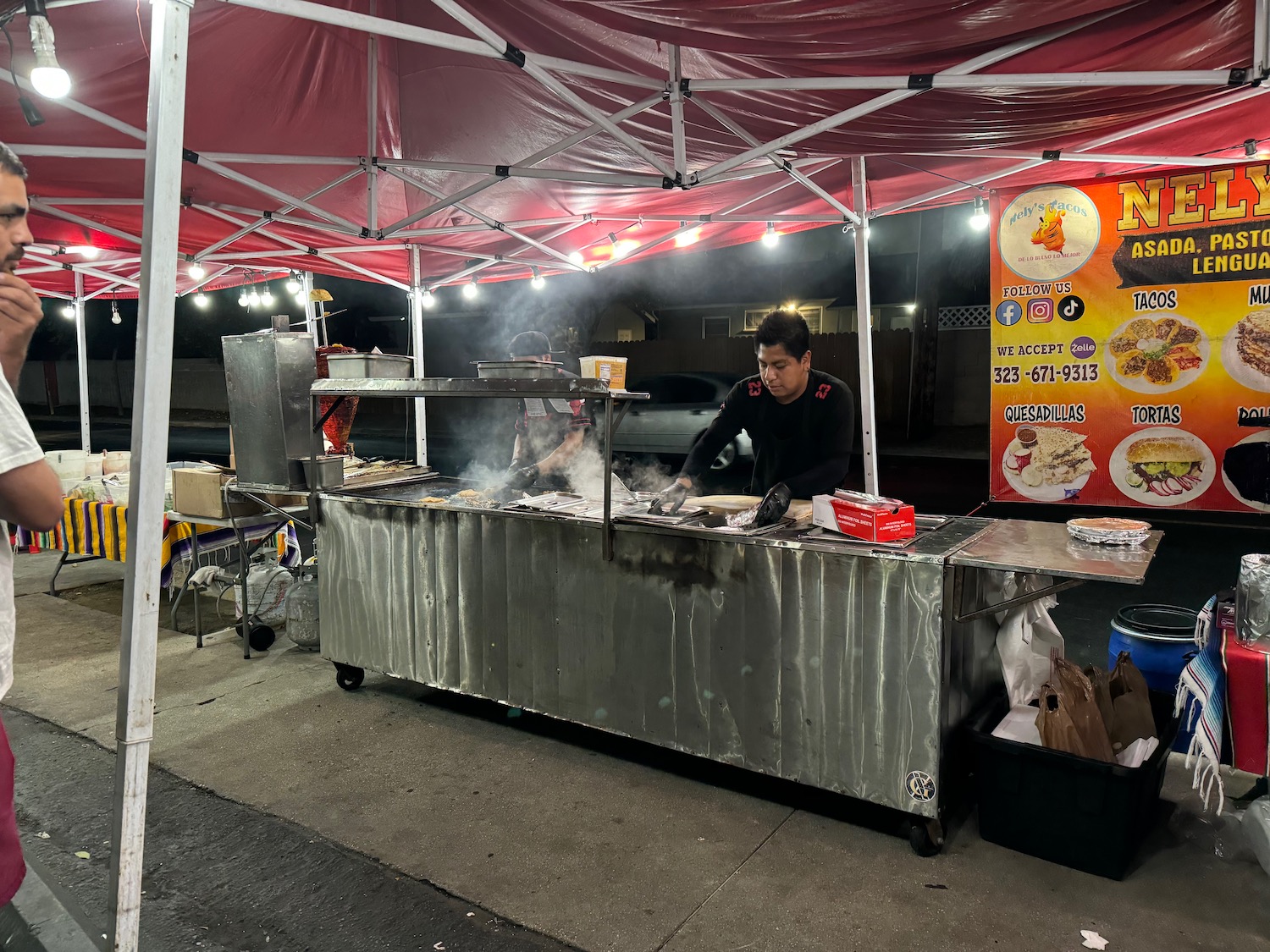 a man cooking food outside