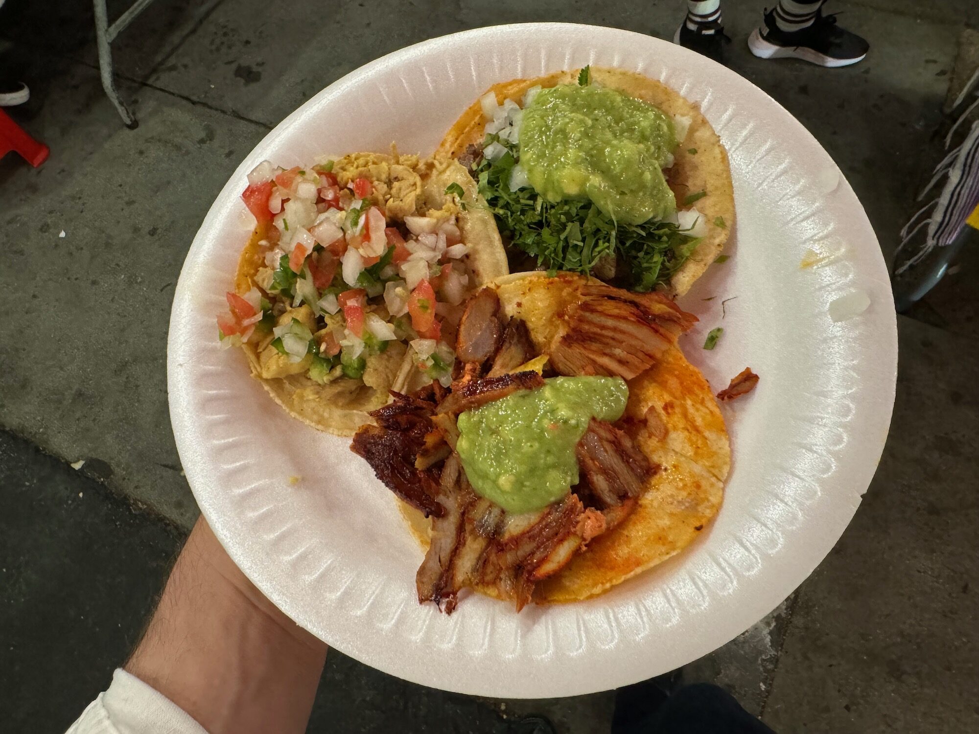 a plate of tacos with salsa and meat