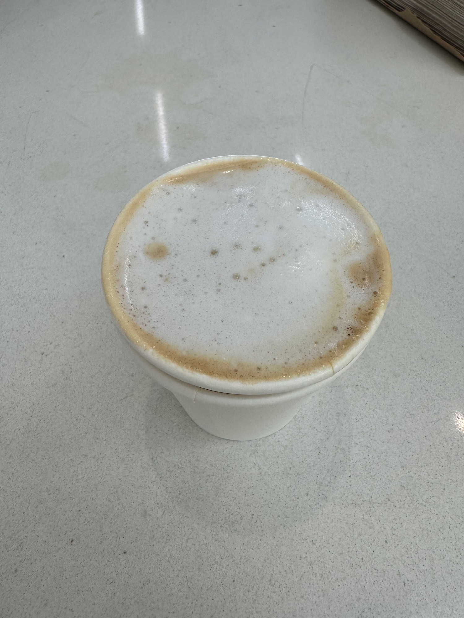 a cup of coffee with foam