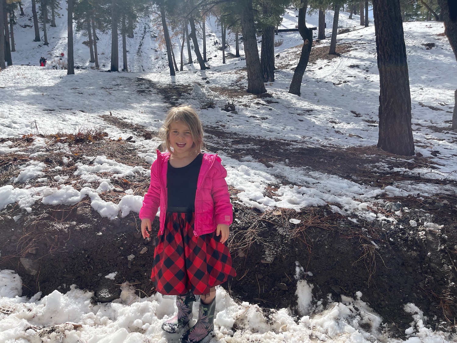 a girl standing in the snow