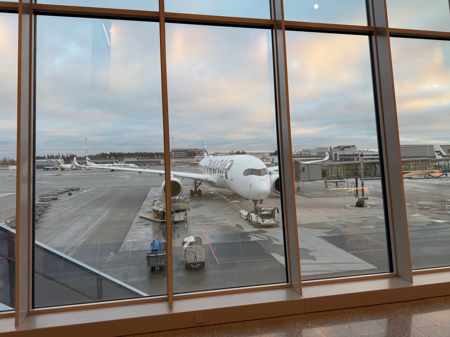 a large window with a large white airplane on the tarmac