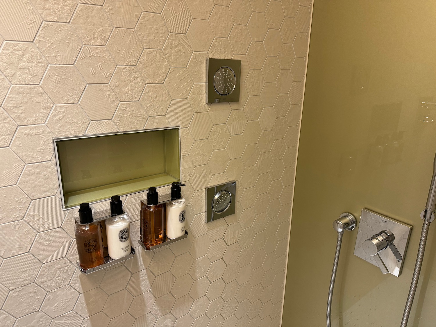 a shower with a shower head and shower head