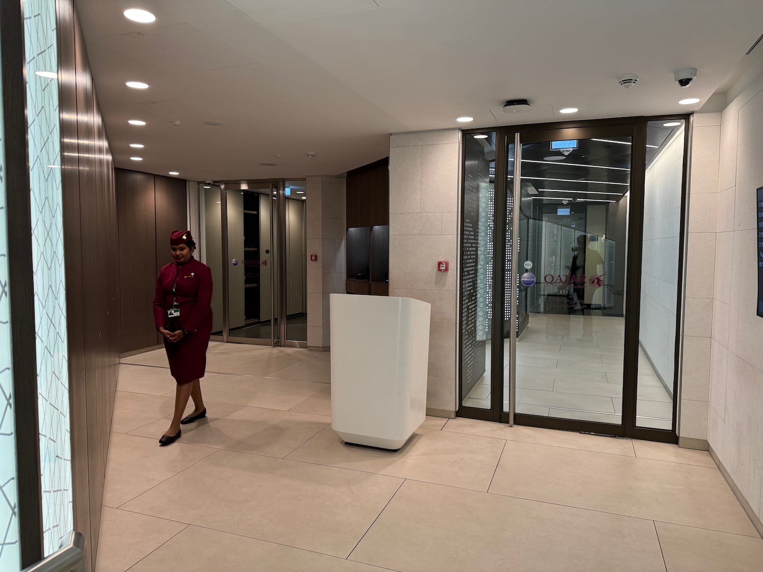 a woman standing in a hallway