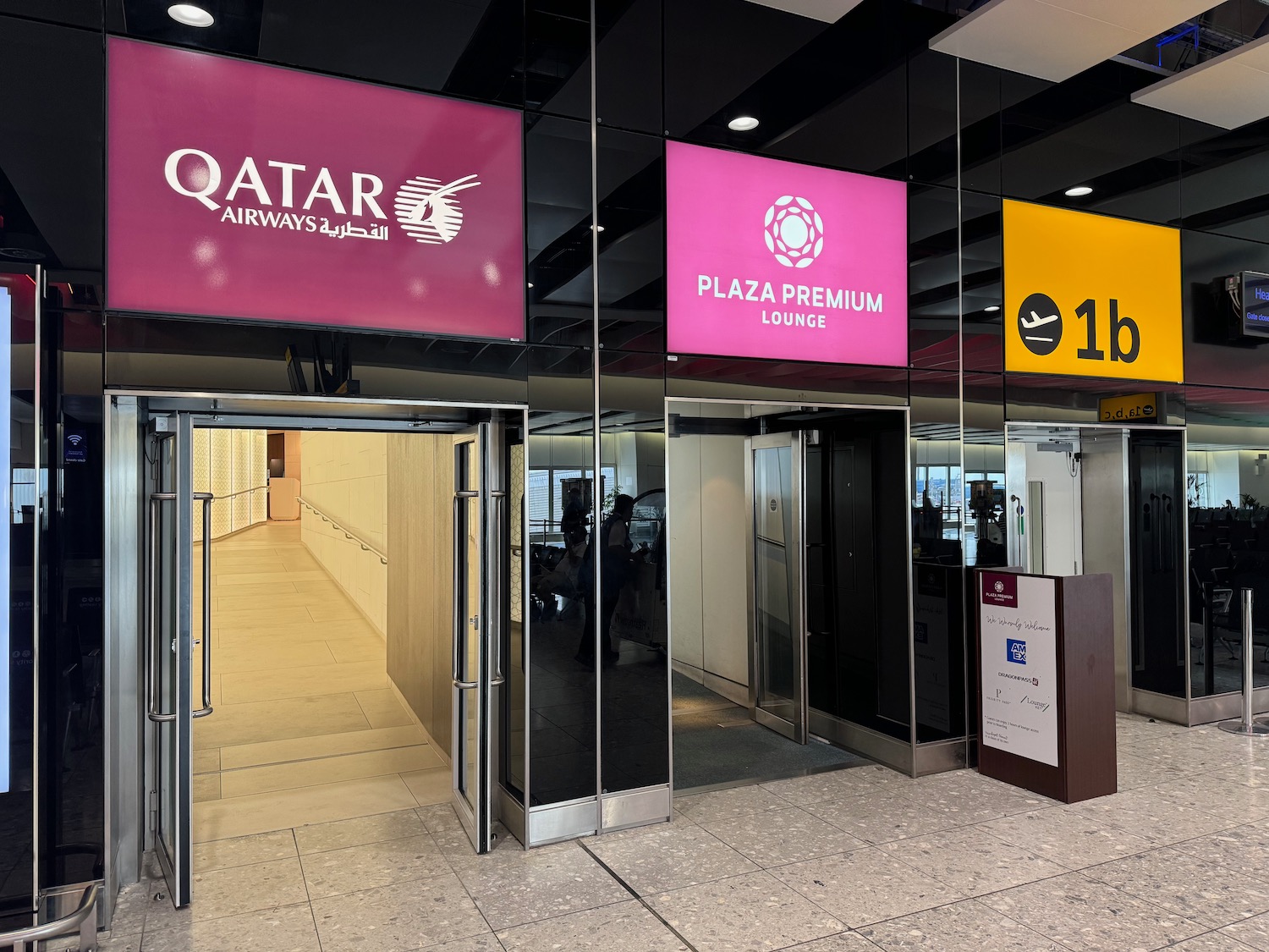 a glass building with signs and signs