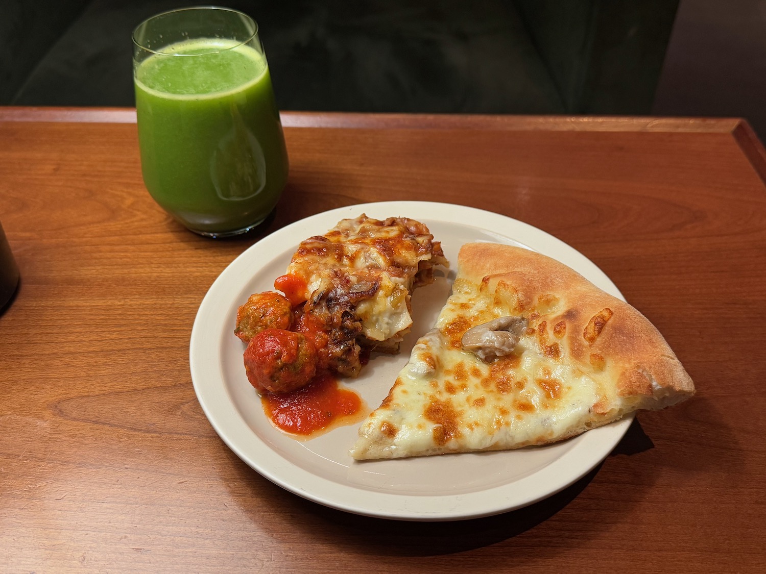 a plate of pizza and a drink