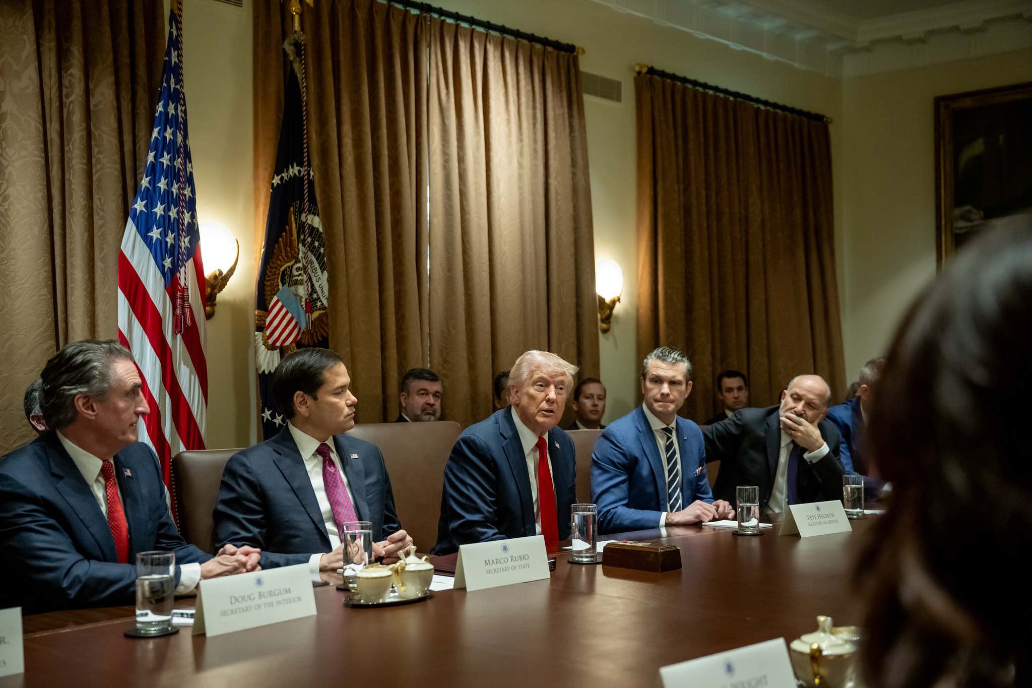 a group of men sitting at a table