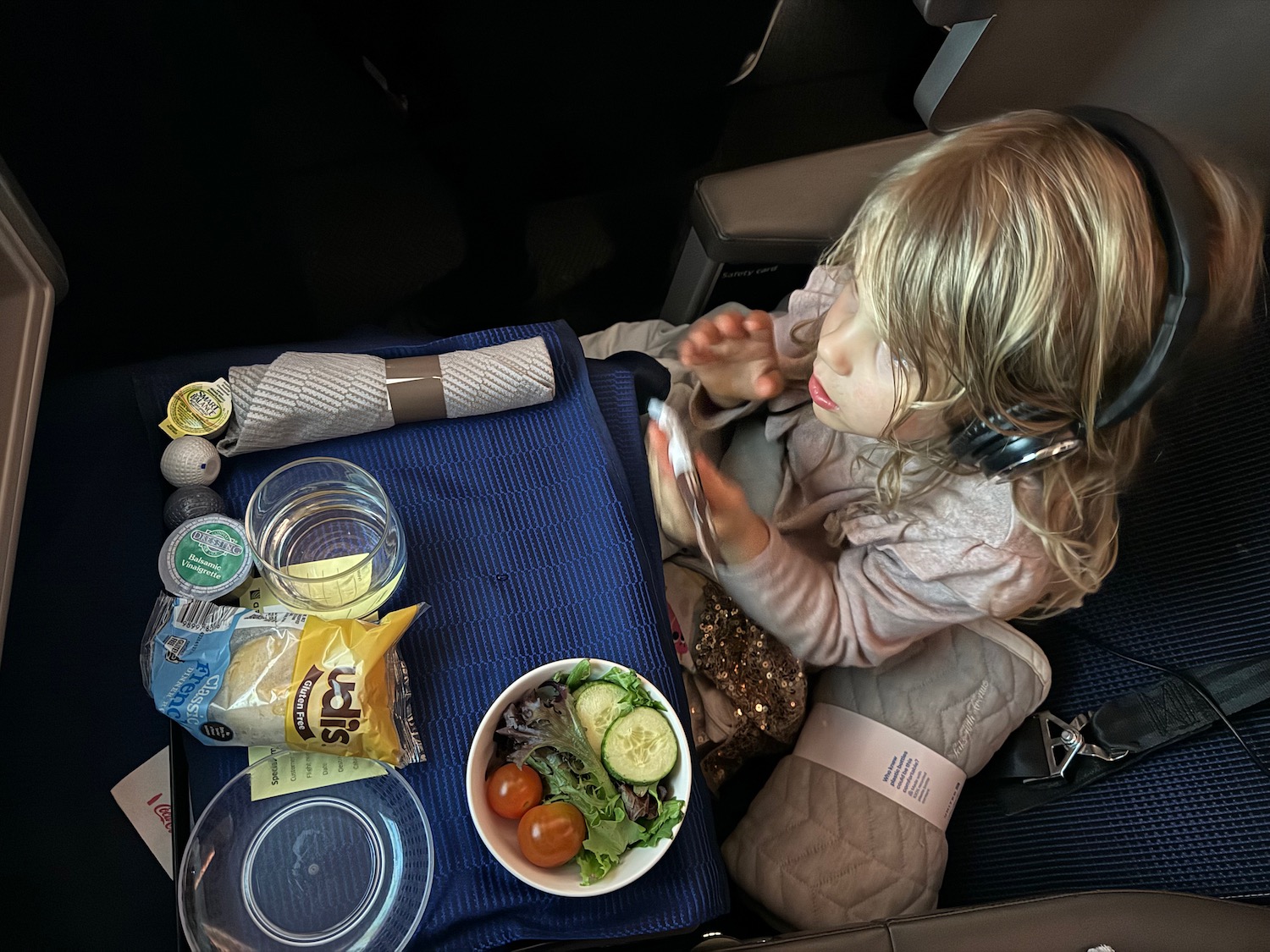 a child eating food on a plane