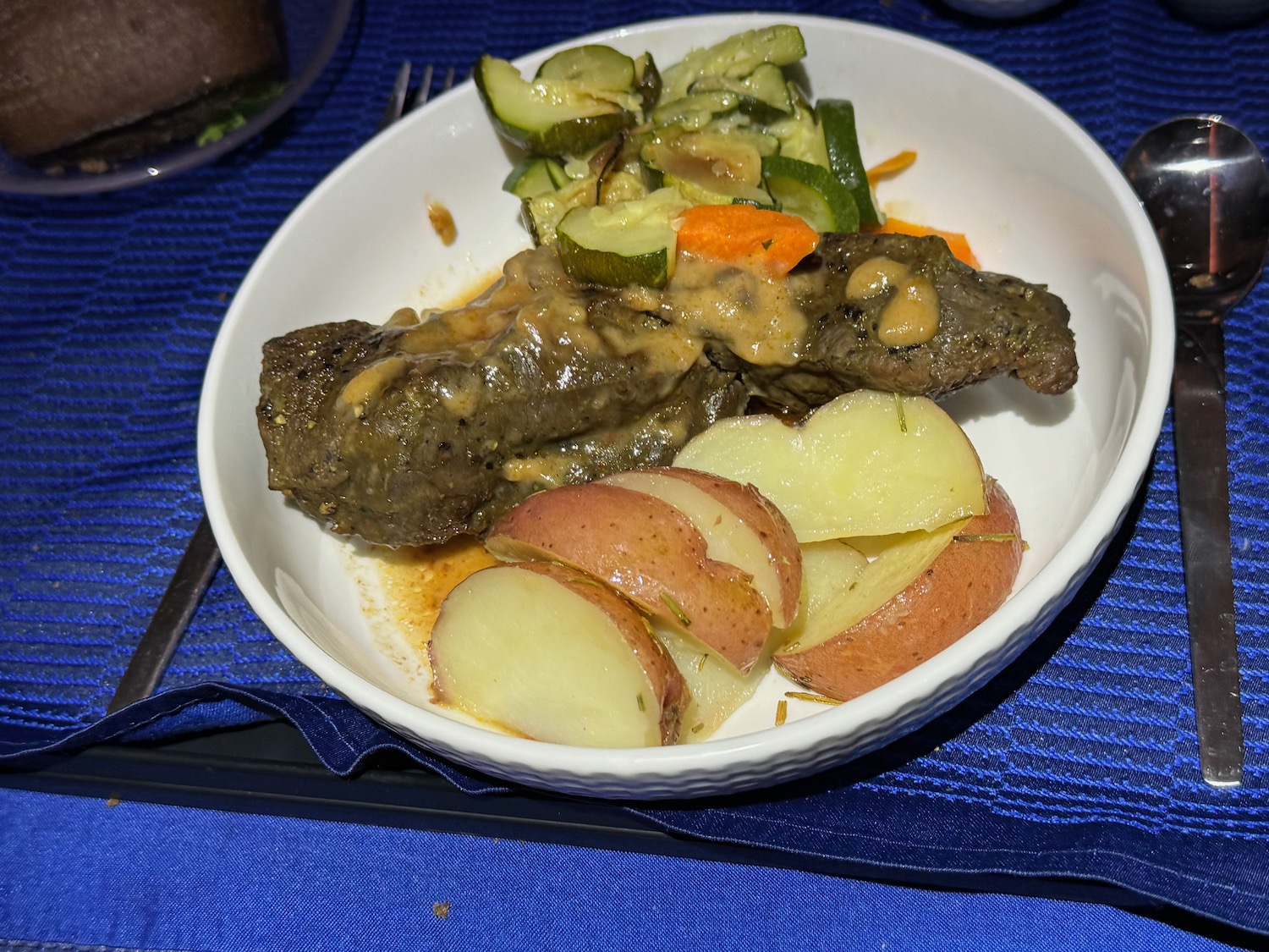 a plate of food on a blue place mat