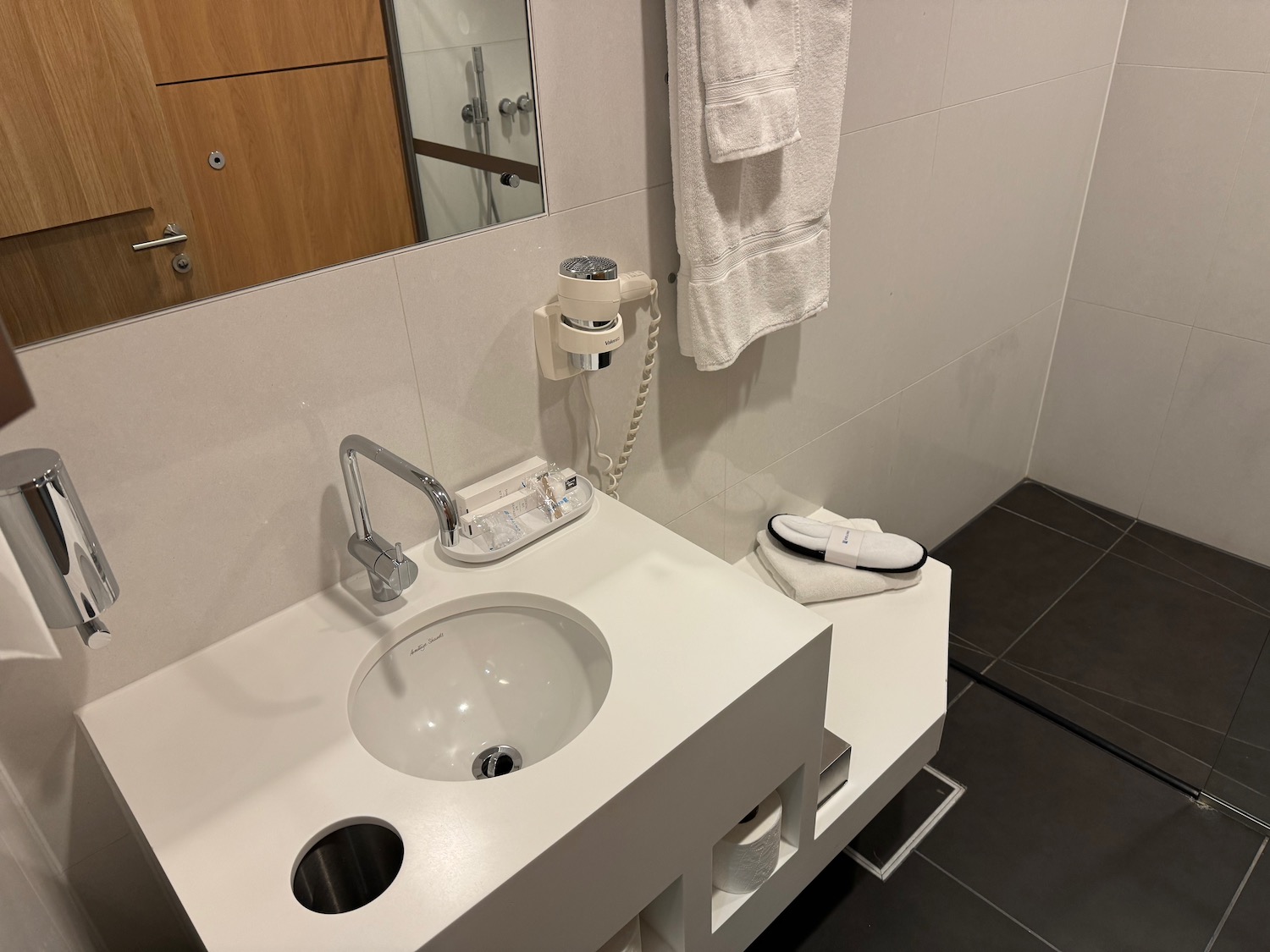 a bathroom with a sink and towel