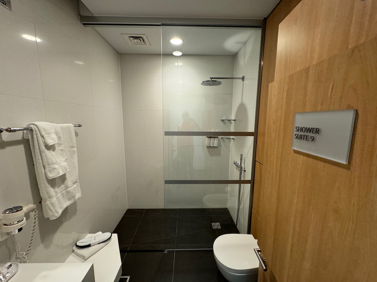 a bathroom with a glass shower door