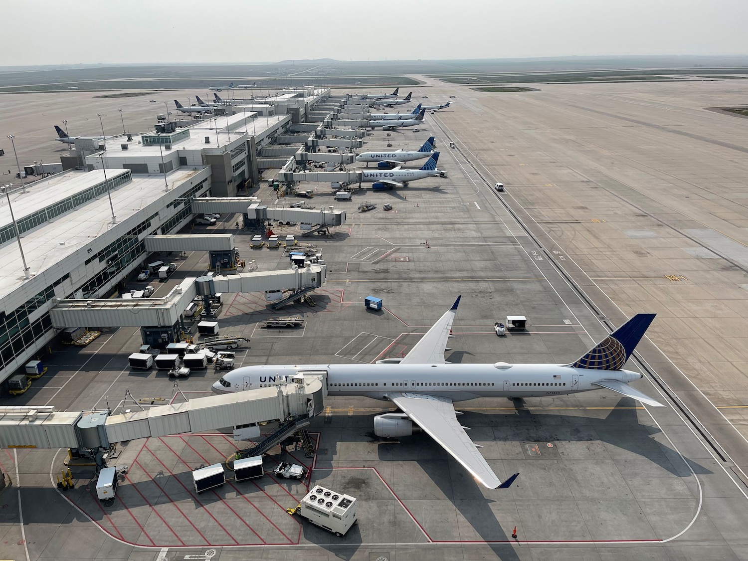 an airport with airplanes parked on the ground