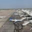 an airport with airplanes parked on the ground