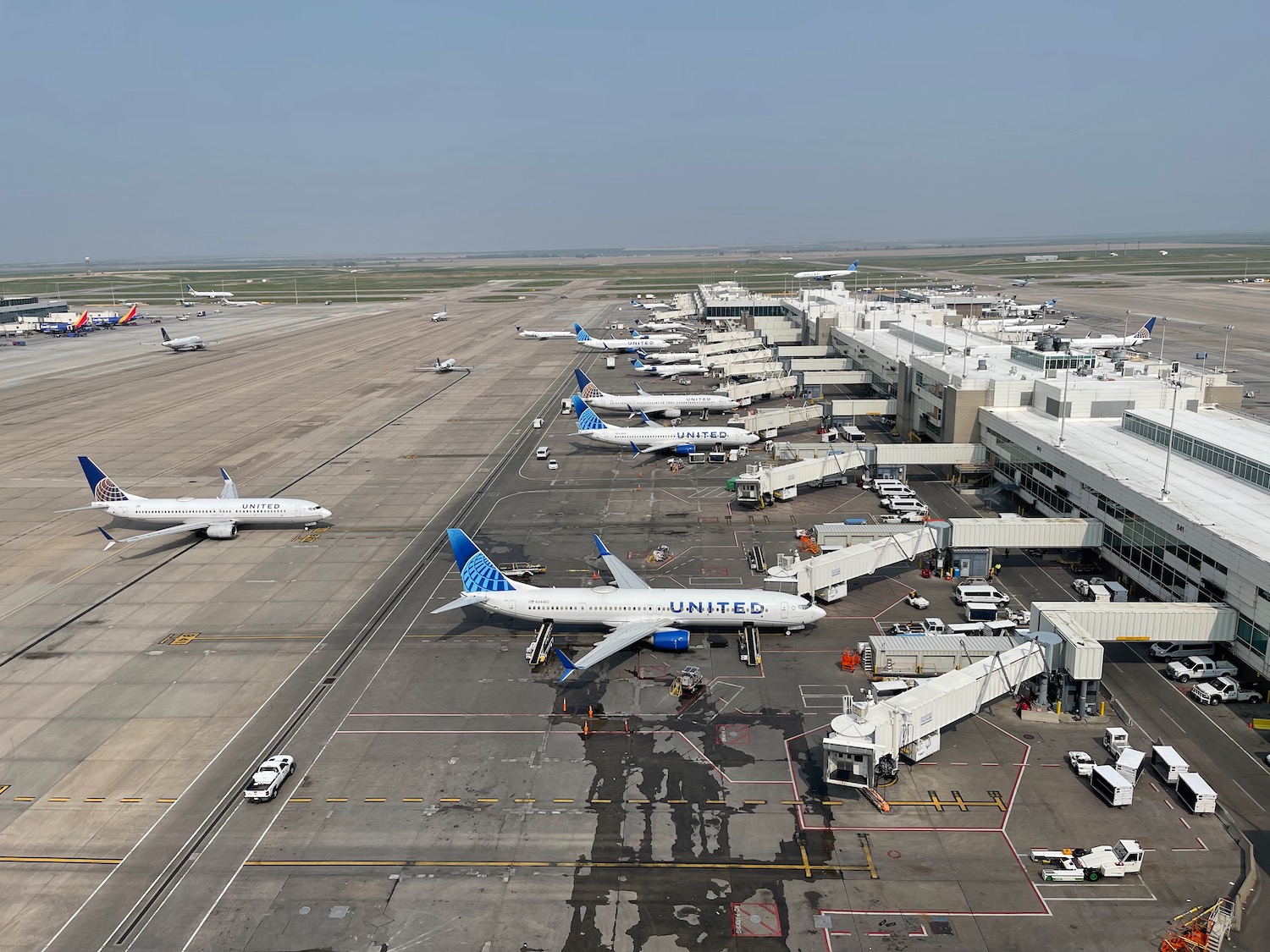 an airport with airplanes parked on the ground