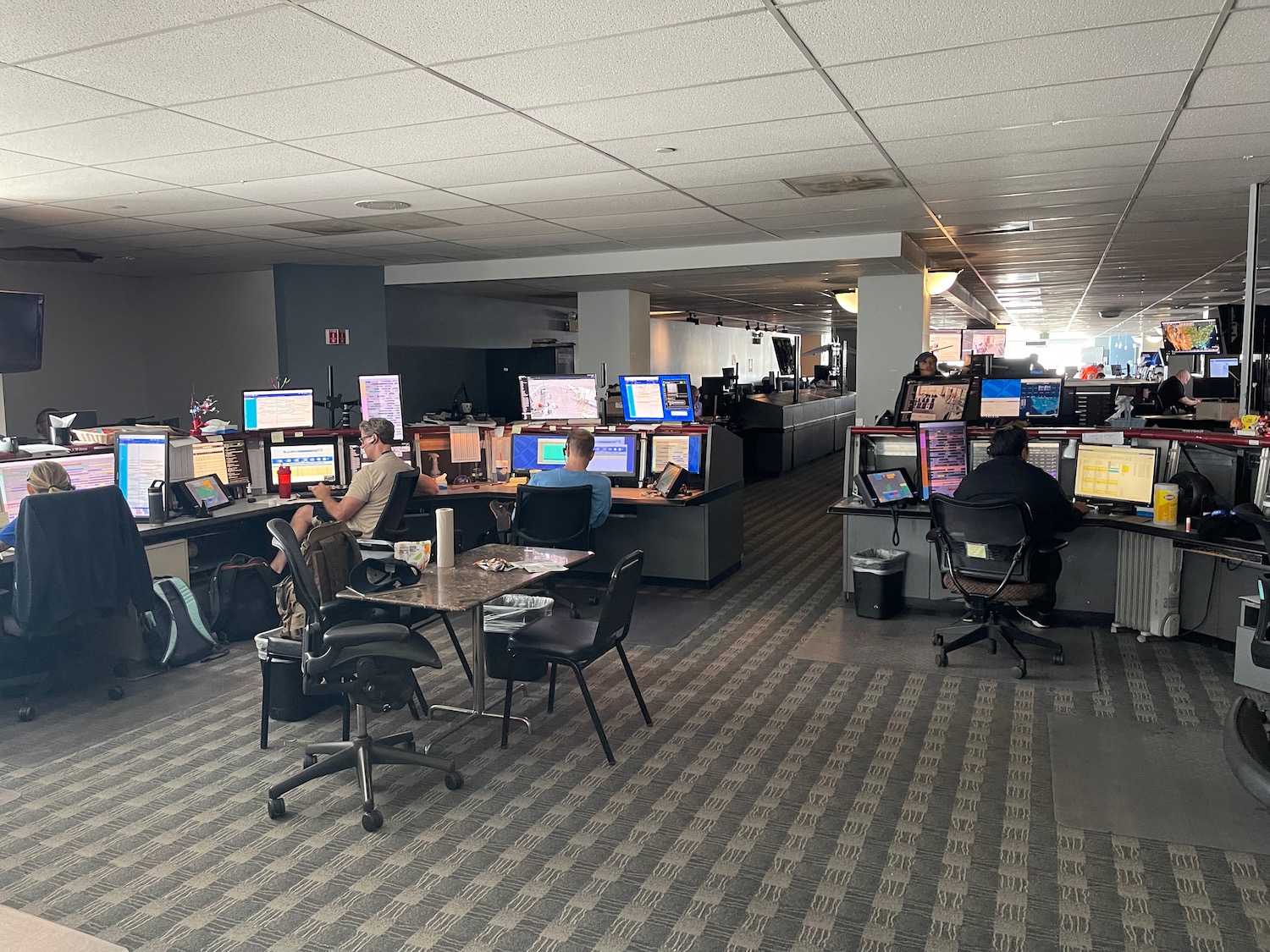 people sitting at computers in an office