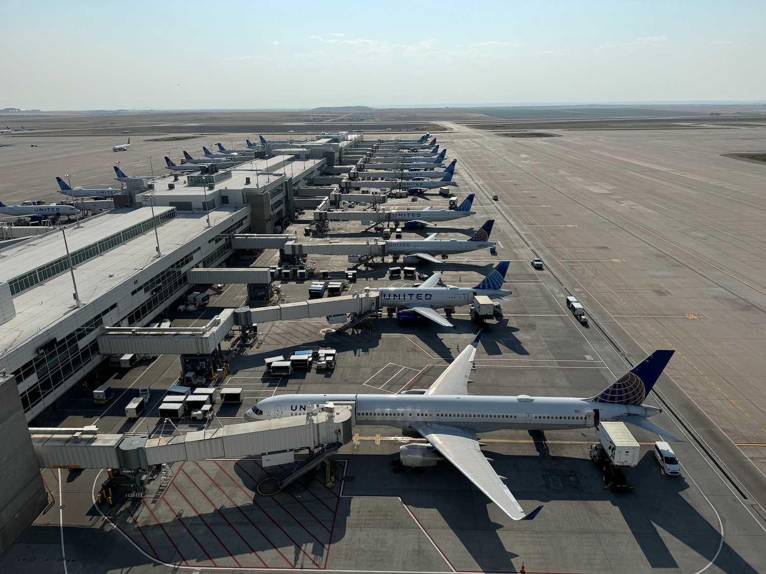 an airport with airplanes parked on the ground